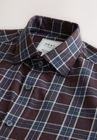 Maroon and blue checked shirt, cotton fabric, button-down collar, two front buttons, white label with "NEXT Tailoring" visible.