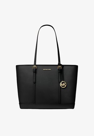 Czarna torba typu tote Michael Kors z podwójnymi rączkami, złotą plakietką z logo i okrągłym zawieszonym na jednej rączce breloczkiem MK.
