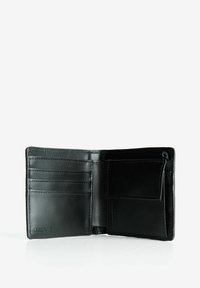 Black leather bifold wallet open, showing multiple card slots on left and a coin pocket with a flap on the right.