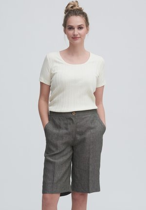 White ribbed short-sleeve top with a scoop neckline, paired with gray tailored shorts featuring a button closure and side pockets.