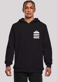 Black hoodie made of soft fabric, featuring a front kangaroo pocket and a small white striped design with an accent at the chest.