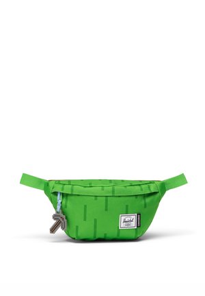 Banane Herschel vert vif avec des rayures vert foncé, un pendentif zip en forme de pioche Minecraft et un patch logo rectangulaire sur le devant.