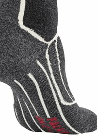 Calzino grigio realizzato in materiale testurizzato con dettagli bianchi e rossi; presenta un design che imita la forma del piede e i modelli di aderenza.