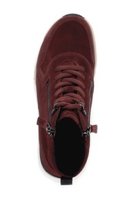 Burgundy suede ankle boot with black zipper accents, round toe, lace-up front, padded collar, and a white rubber sole.