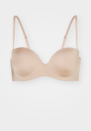 Beige padded bra with smooth texture, underwire support, and adjustable straps. Contoured cups in a plunging design for a seamless fit.