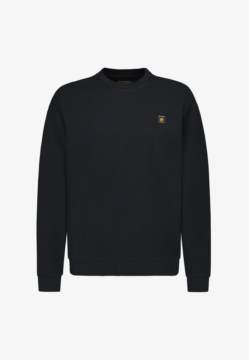 Black sweatshirt made of textured fabric, featuring a round neck, long sleeves, and a small gold logo patch on the left chest.