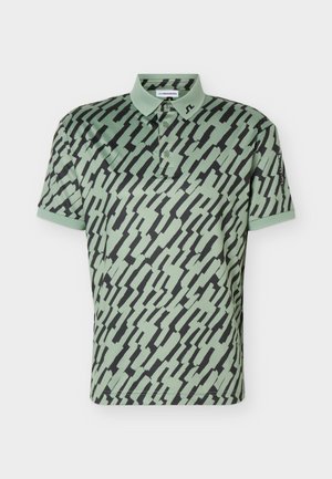 Lys grønn poloskjorte med abstrakt svart sikksakkmønster, tre-knappers klaff og liten logo på kragen.