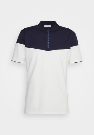 Polo bicolore con parte superiore blu navy e parte inferiore bianca. Realizzata in morbido cotone, con colletto e patta con bottoni.