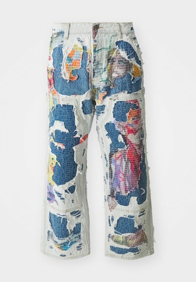 Denim wide-leg pants with an unfinished, distressed look, featuring colorful fabric patches and large cutouts throughout the design.