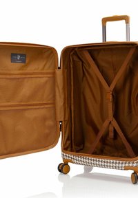 Hartschalenkoffer in Orange mit einem gemusterten Boden. Das Innere verfügt über eine Netztasche und Kompressionsriemen; sanft laufende Rollen für Mobilität.
