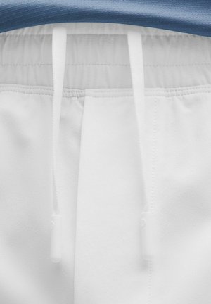 Hvide joggerbukser med elastisk talje, der har en blå stoftop. Hvide snore med plastispidser til justering. Blød tekstur.