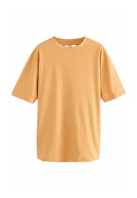 Kortærmet t-shirt i blød, lys orange bomuld med afslappet pasform, rund halsudskæring og enkelt, uden pynt.