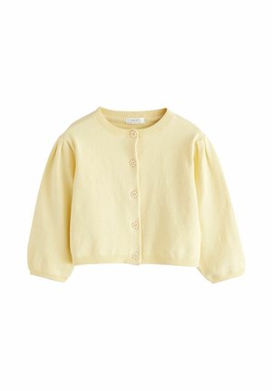 Cardigan tricoté jaune clair avec de longues manches bouffantes et cinq petits boutons en forme de fleur sur le devant.