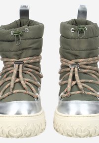 Green puffy snow boots with silver toe cap and platform sole. Feature brown and orange patterned laces and metal hardware accents.
