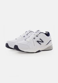 Pair of white New Balance athletic shoes with navy accents and laces, side logo, and cushioned sole on a plain white background.