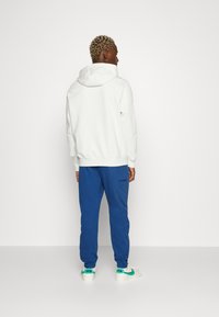 Jordan WARMUP PANT - Calças de fato de treino - french blue
