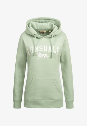 Haut à capuche vert menthe avec une poche kangourou à l'avant, des cordons de serrage et un texte blanc indiquant "LONSDALE" sur un graphique de lion. Texture de tissu douce.