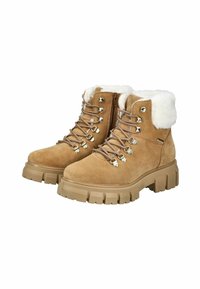Stivaletti ankle in suede marrone chiaro con colletto in pelliccia sintetica bianca, occhielli metallici e lacci. Sottopiedi in gomma marrone spesso con un design robusto per stabilità.