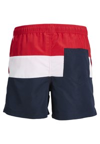 Bañadores de hombre con rayas horizontales rojas, blancas y azules marinos, con una cinturilla elástica y un bolsillo trasero. Tela ligera.