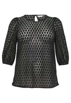 Blusa nera in pizzo con ritagli circolari, maniche a sbuffo tre quarti e scollo a chiave. Morbida al tatto con un aspetto trasparente.