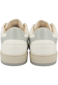 White sneakers with a smooth leather upper, gray heel accents, and a textured rubber sole. Rear view reveals cushioned collars and branding.