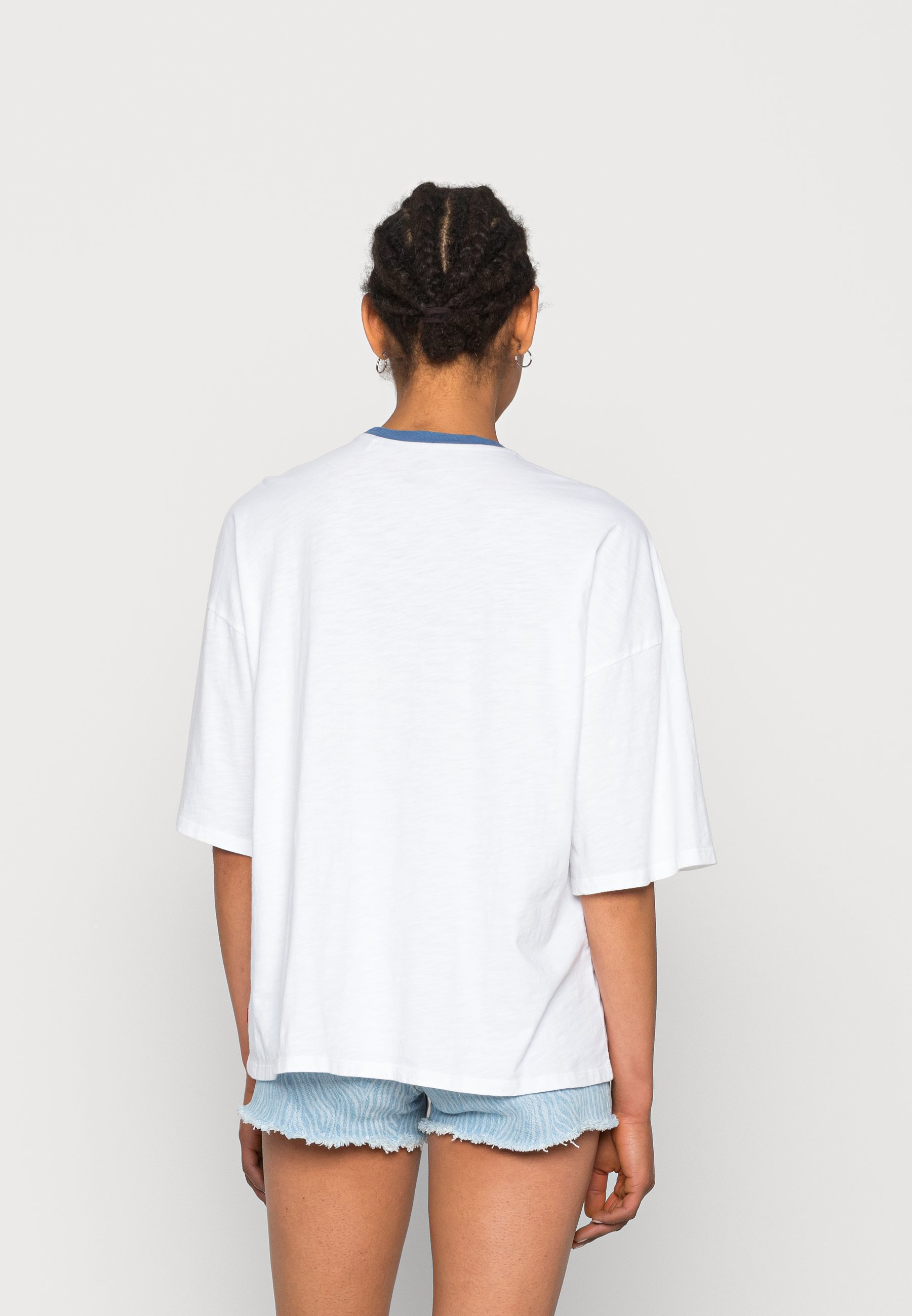 white tee with blue graphic