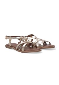 Metallisch goldene Riemchensandalen mit einer flachen braunen Sohle, ausgestattet mit verstellbaren Knöchelriemen und einem strukturierten Fußbett, geeignet für die Freizeit.