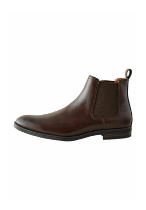 Brown leather Chelsea boot featuring elastic side panels, a smooth finish, rounded toe, and a pull tab at the heel for easy wear.
