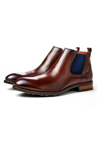 Braune Chelsea-Stiefel aus Leder mit elastischen Seitenteilen, spitz zulaufender Spitze und Holzabsatz. Glatte Textur und elegantes Design.