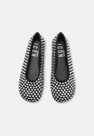 Black flat shoes adorned with silver rhinestones, rounded toe, and a smooth inner lining. Logo visible on the insole.