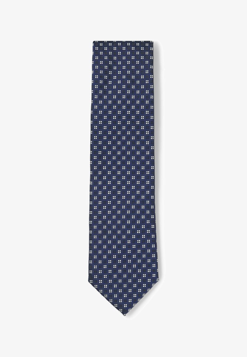 Merennehyvä solmio, jossa on geometrinen kuvio pienistä valkoisista neliöistä. Solmio on valmistettu teksturoitusta kankaasta, sillä on kapea muoto ja terävä pää.