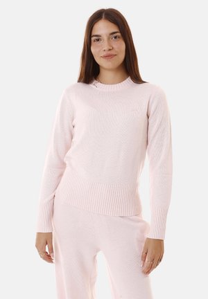 Maglione lavorato a maglia rosa chiaro con orlo e polsini a coste, design a girocollo e motivo testurizzato su tutta la stoffa.