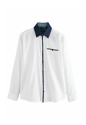 Valge pikkade varrukatega särk tumesinise tekstuuriga kraega ja täpilise sisemise voodriga. Omab tumesinist tasku aktsenti ja tumedaid nuppe.