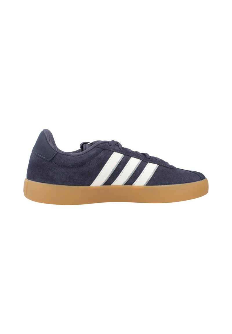 Blue suede sneaker with white stripes, rubber gum sole, and a low-profile design. Features round laces and padded collar for comfort.