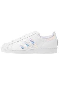 White leather sneaker with a textured toe cap, featuring three iridescent stripes and perforations on the side. Rubber sole.