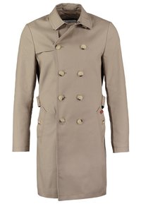 Trench-coat beige à double boutonnage avec huit boutons, deux poches avant et un col classique.