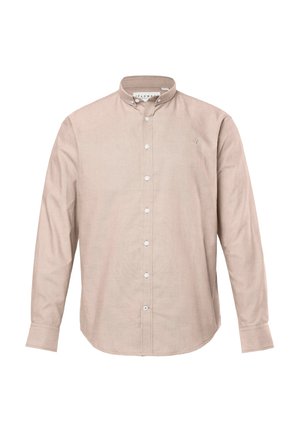 Beige pitkähihaisen napitettavan paidan, joka on valmistettu teksturoidusta kankaasta. Yksityiskohtana napillinen kaulus ja palkattu logo vasemmassa rinnassa.