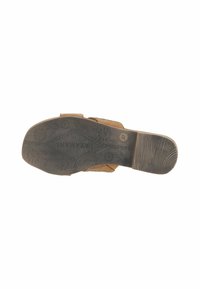 Brown sandal sole with textured rubber material. Features a diamond pattern and floral designs on the surface. Light wear visible on heel.