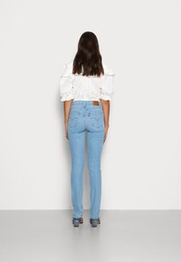 Levi's® HIGH RISE  - Calças de ganga de perna direita - rio launch