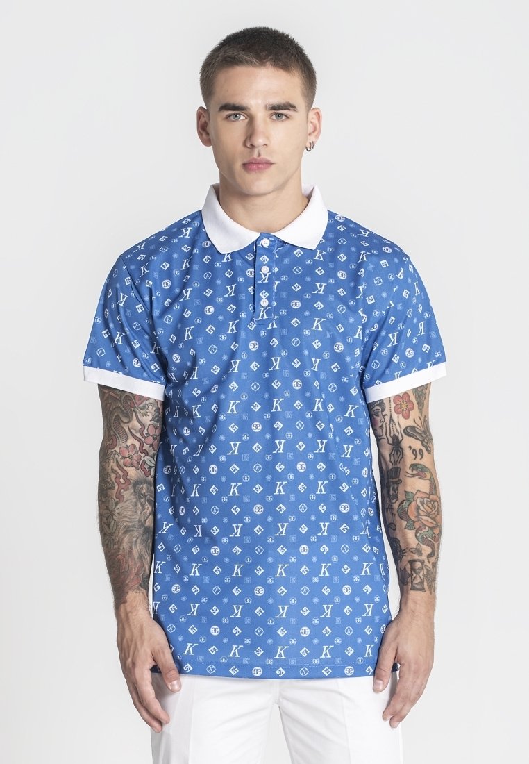 Modrá polokošile s bílým límečkem a manžetami, zdobená opakujícím se vzorem loga. Krátké rukávy, slim fit, vyrobena z hladkého materiálu.