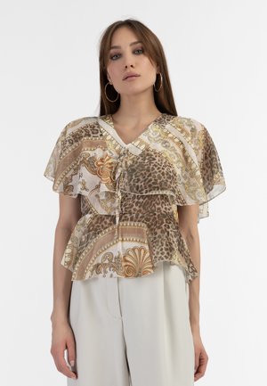 Trykt peplum top med lagdelte flæser, præget af dyreprint og udsmykkede gyldne mønstre i brune og kremfarvede nuancer. V-halsdesign.