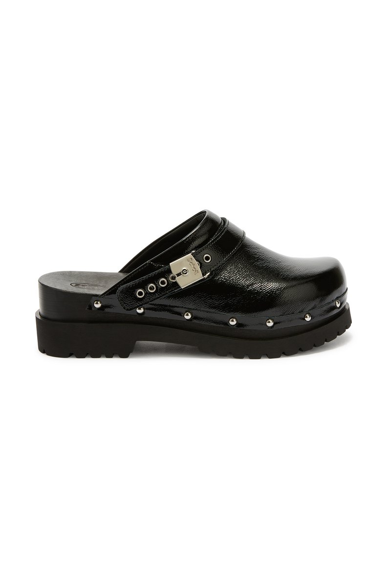 Black patent leather clog with studded trim, silver buckle strap, and thick ridged sole, left side view on white background.