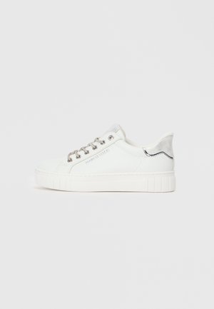 White sneaker with a smooth leather upper, silver accents, textured outsole, and metallic laces. Features a slightly elevated sole design.