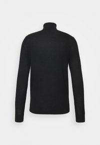 Pull noir à col roulé à manches longues, vu de dos sur un fond blanc uni.