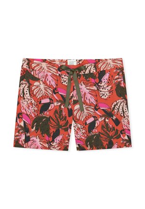 Red shorts with pink and green tropical leaf and toucan bird print, featuring a dark green tie string at the waist.