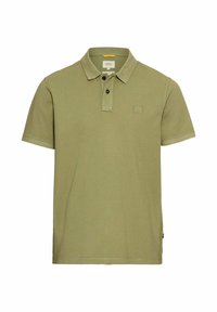 Oliven grøn polo skjorte lavet af bomuld, med en folded krave, to knapper og et lille logo-patch på brystet. Korte ærmer.