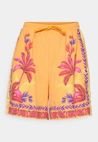 Oransje svømmeshorts med blomsterdesign i rosa, lilla og grønn. Elastisk midjebånd med snøring. Lett, teksturert stoff.