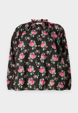 Blusa preta com padrão de flores em rosa e verde, decote com babados, frente com botões e mangas longas com punhos elásticos.