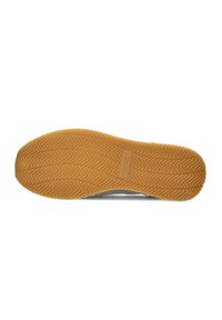Rubber shoe sole with a herringbone pattern; features a light brown color. The material is flexible, providing support and grip.