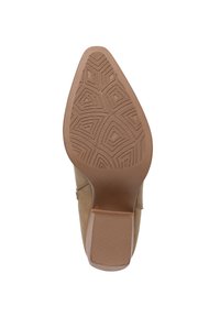 Suela de zapato de tacón alto beige con un patrón de goma texturizada, que presenta un diseño afilado y bordes suaves. Acentuada con un ligero brillo.